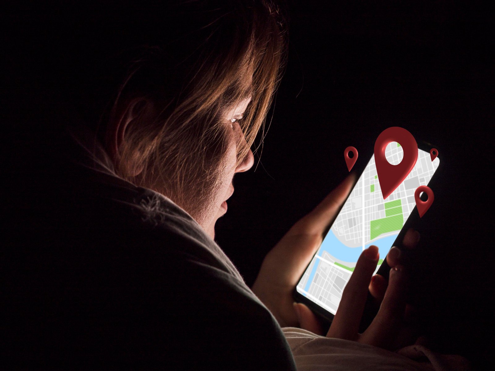 side view woman holding smartphone scaled